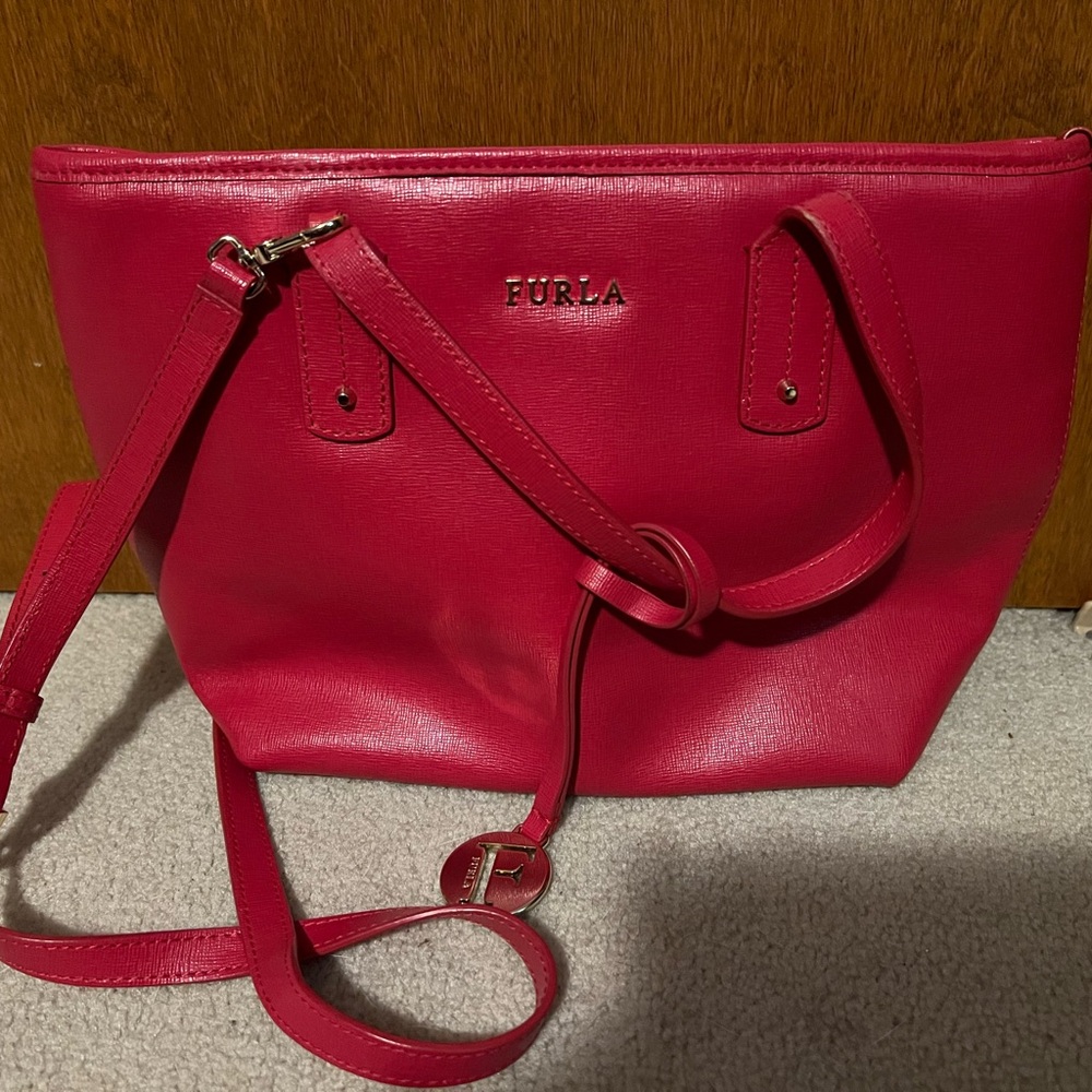 Furla Vibrant Crossbody Bag. I would say it’s more of a Red color.